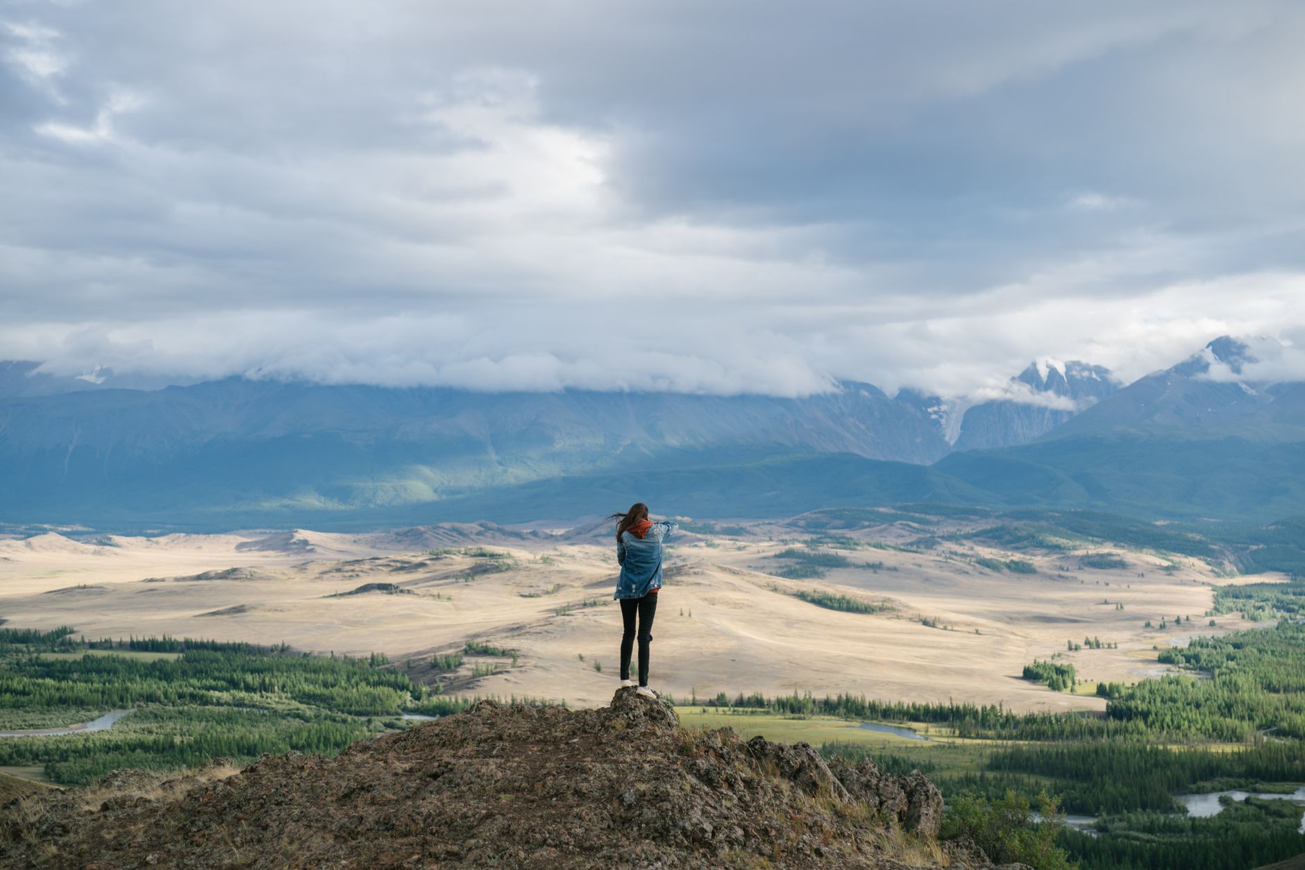 Travel journal editor overlooking scenic valley