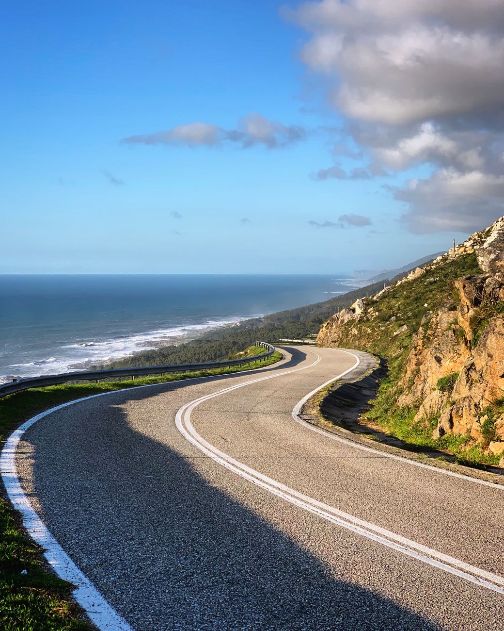 Winding scenic road above Pacific ocean